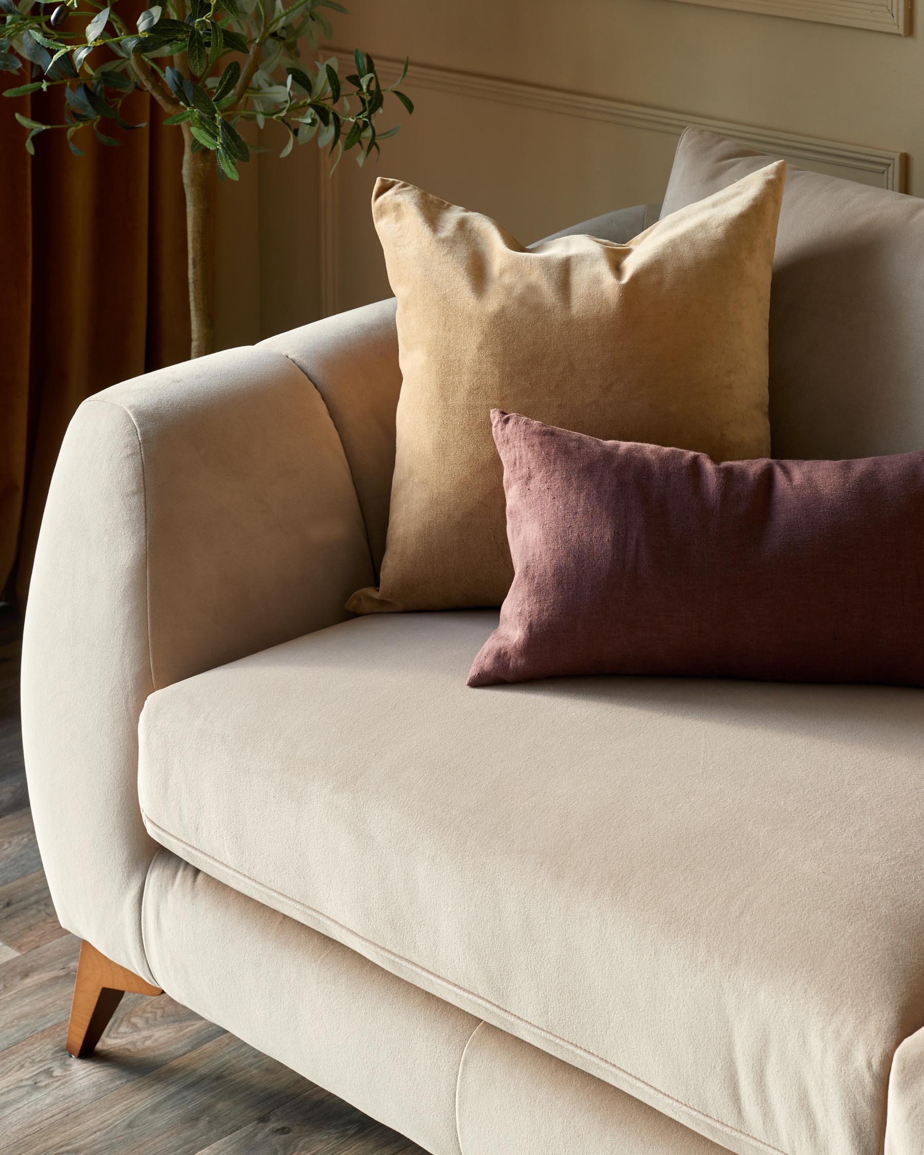 Genevieve champagne velvet 3 seater sofa with wooden leg