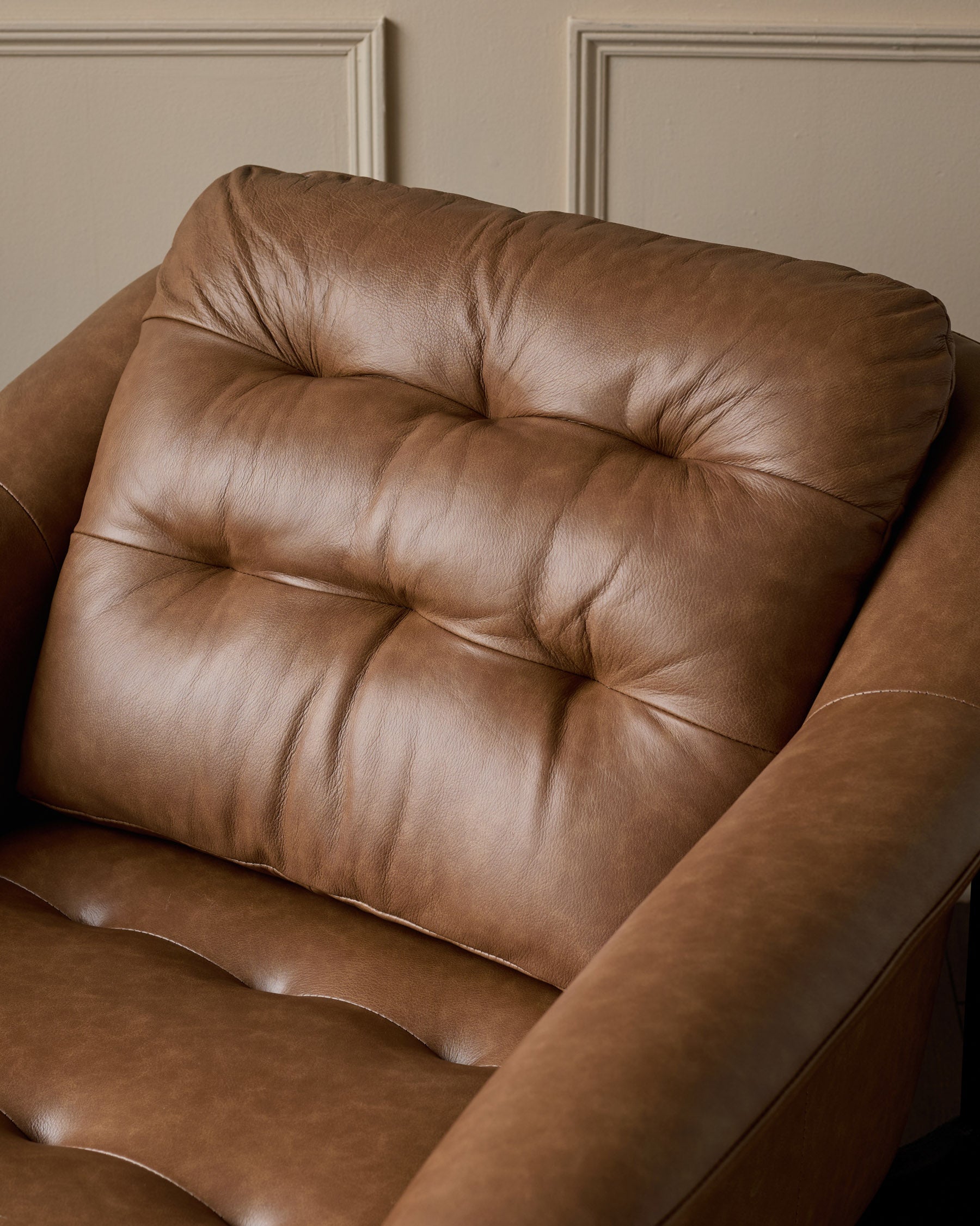 Ember tan leather occasional chair with footstool