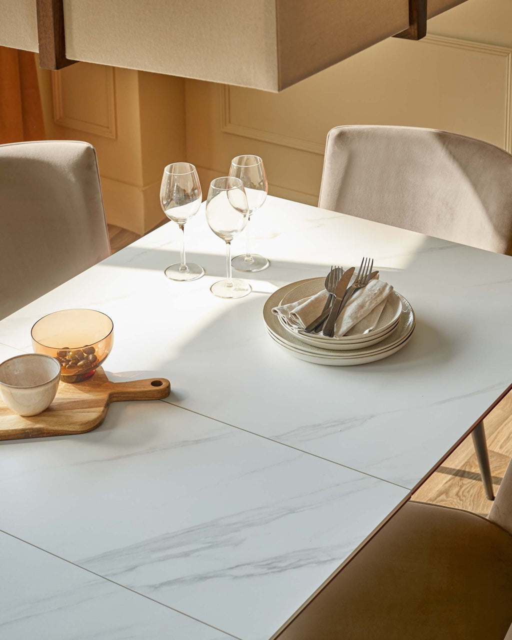 Hayden 6-8 White Ceramic Dining Table with 6 Serena Champagne Plush Velvet Dining Chairs