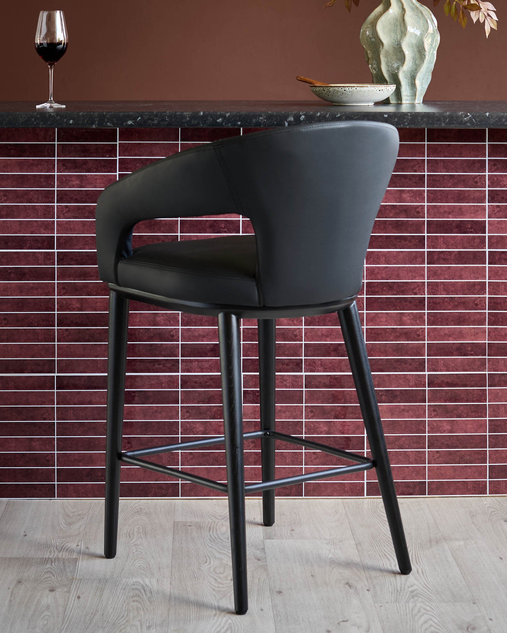 Heath black faux leather bar stool