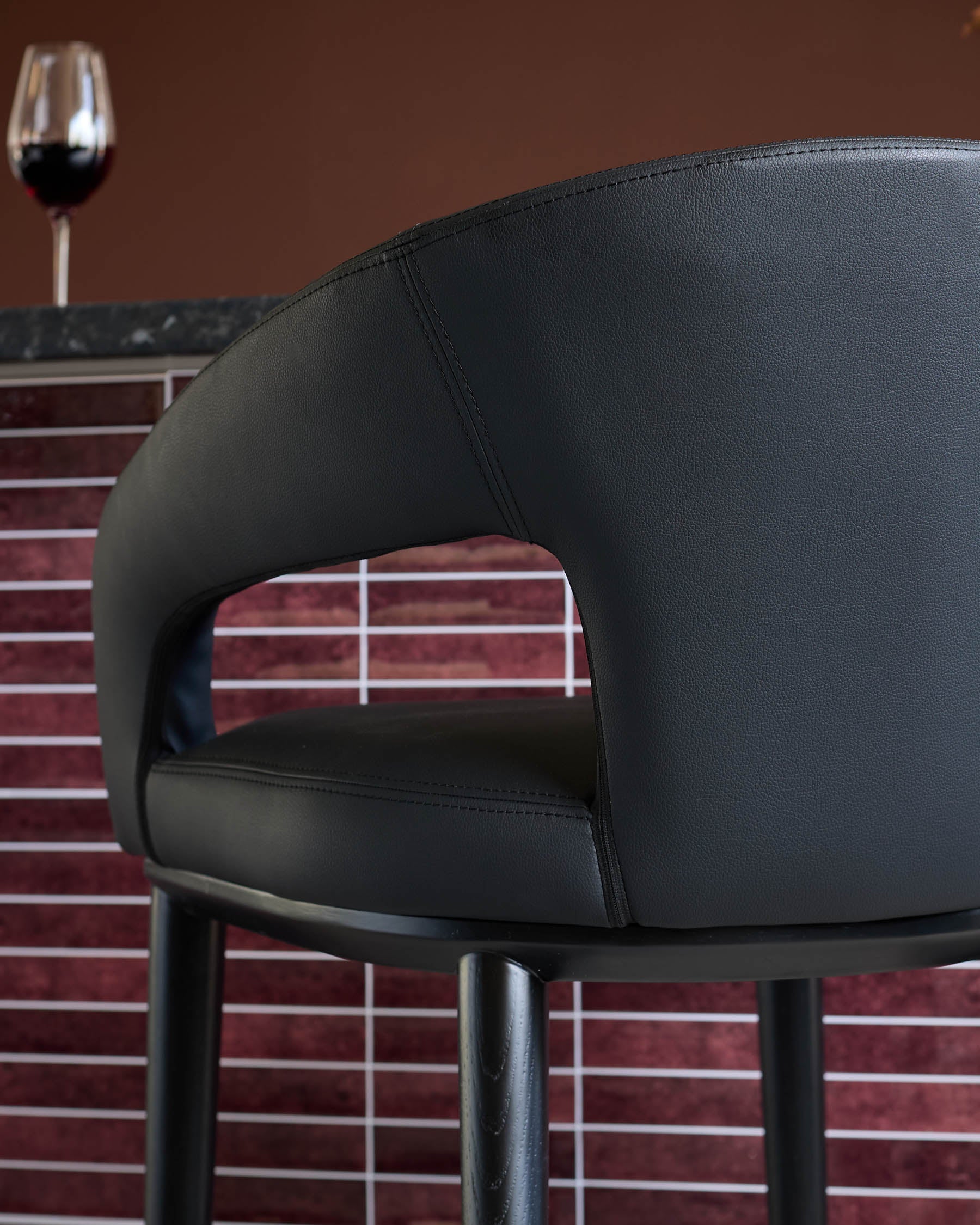 Heath black faux leather bar stool