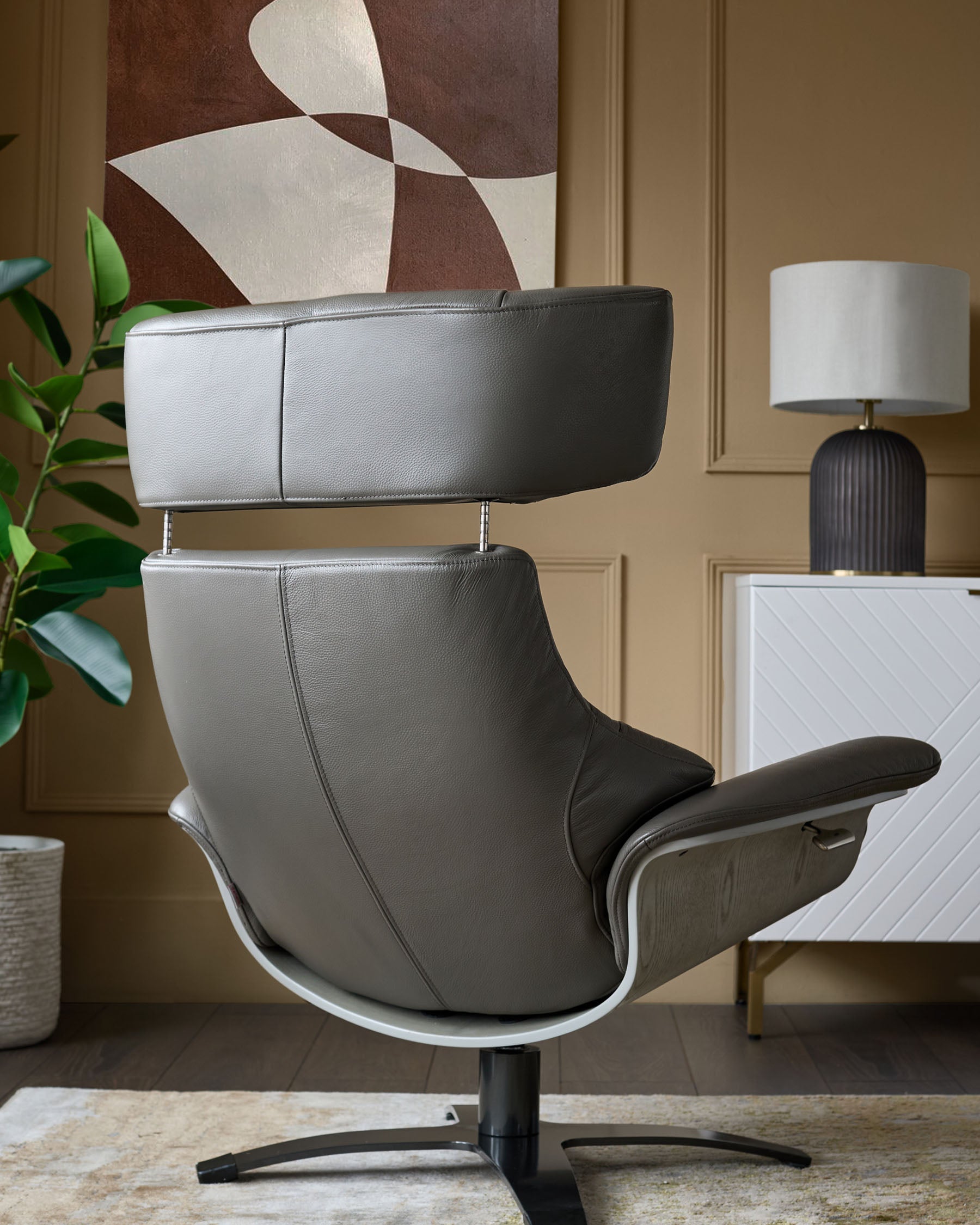 Karma dark grey leather swivel recliner accent chair and footstool