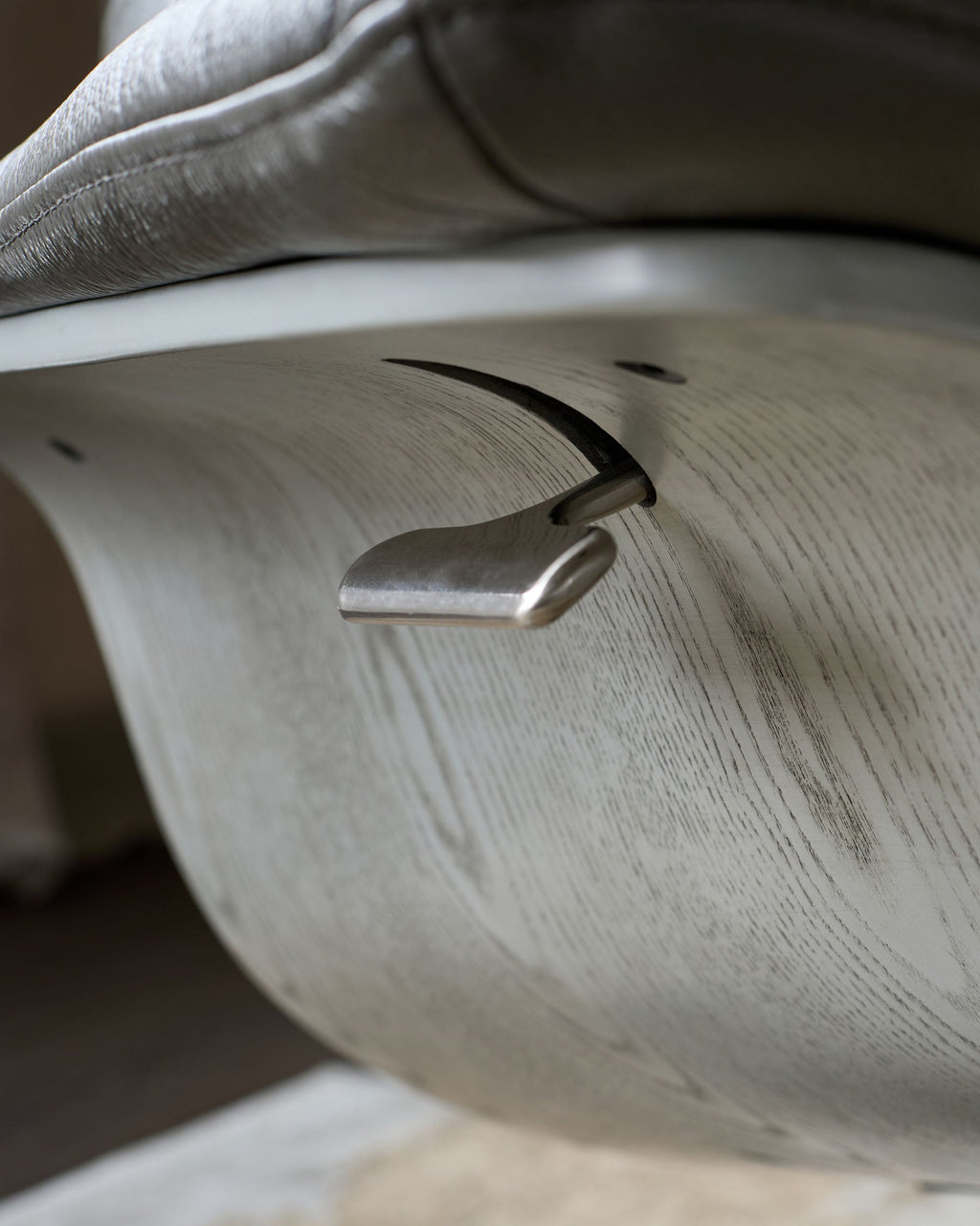 Karma dark grey leather swivel recliner accent chair and footstool