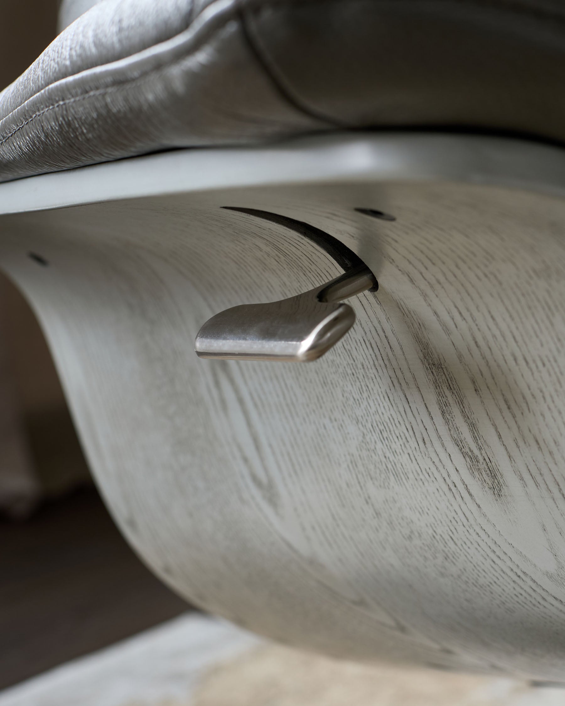 Karma dark grey leather swivel recliner accent chair and footstool