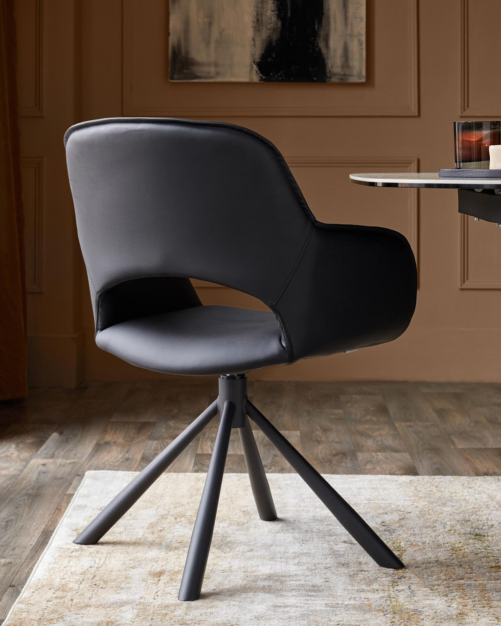 Marlow black faux leather swivel dining chair