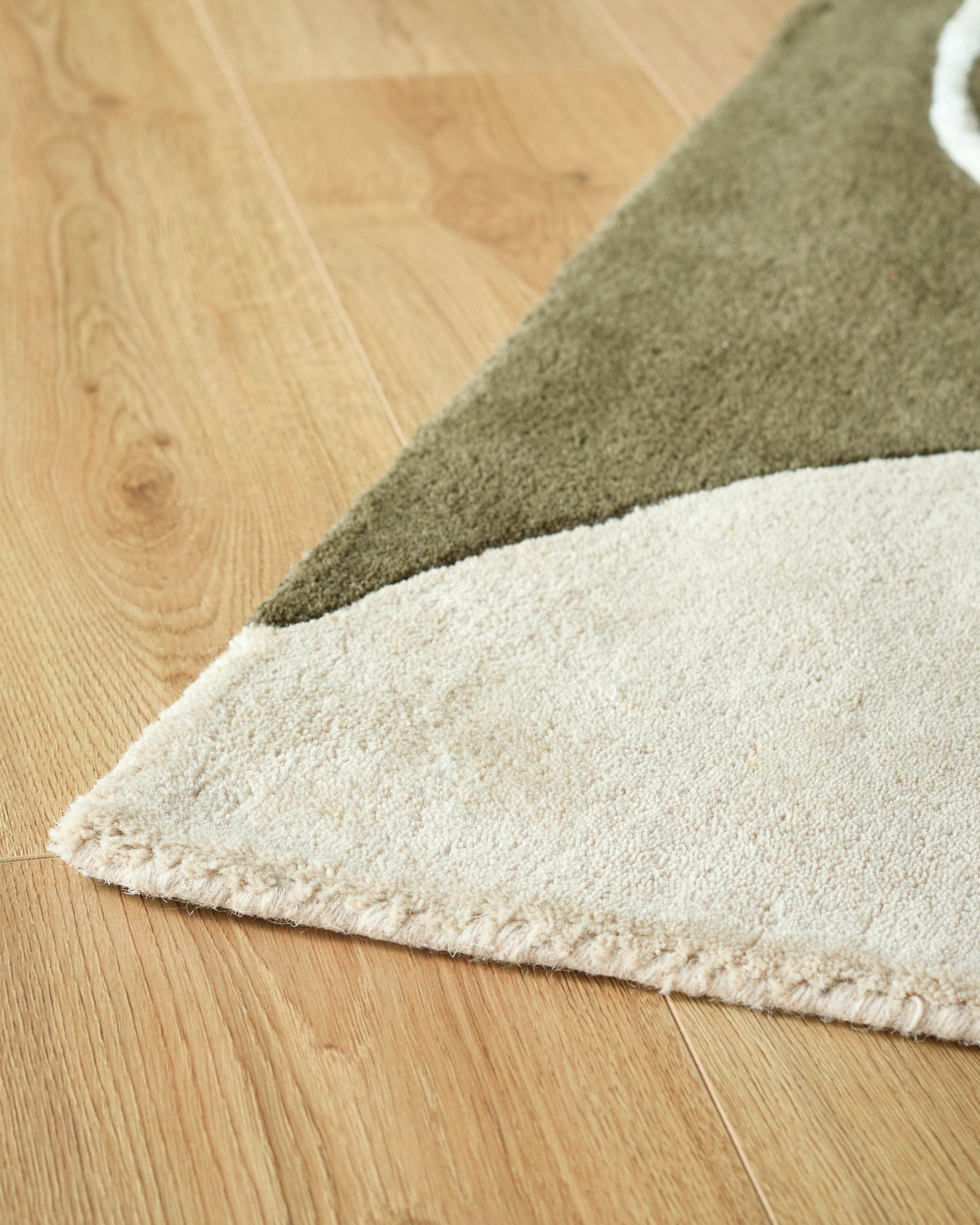 Neo olive and navy textured small wool rug