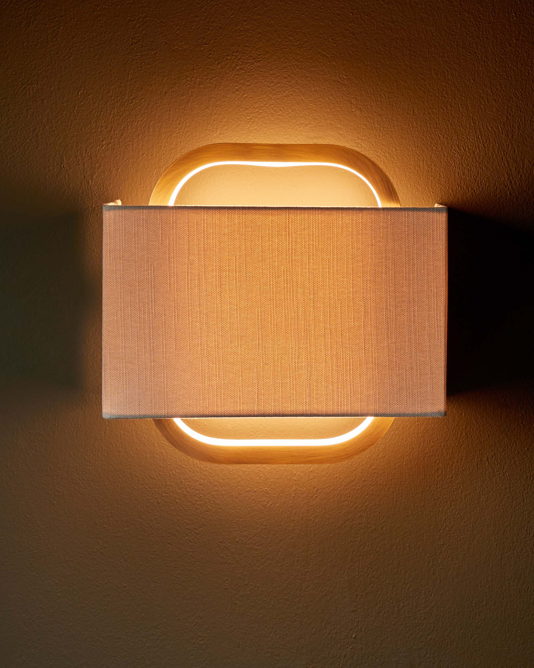 Sanza natural linen and brushed bronze wall light