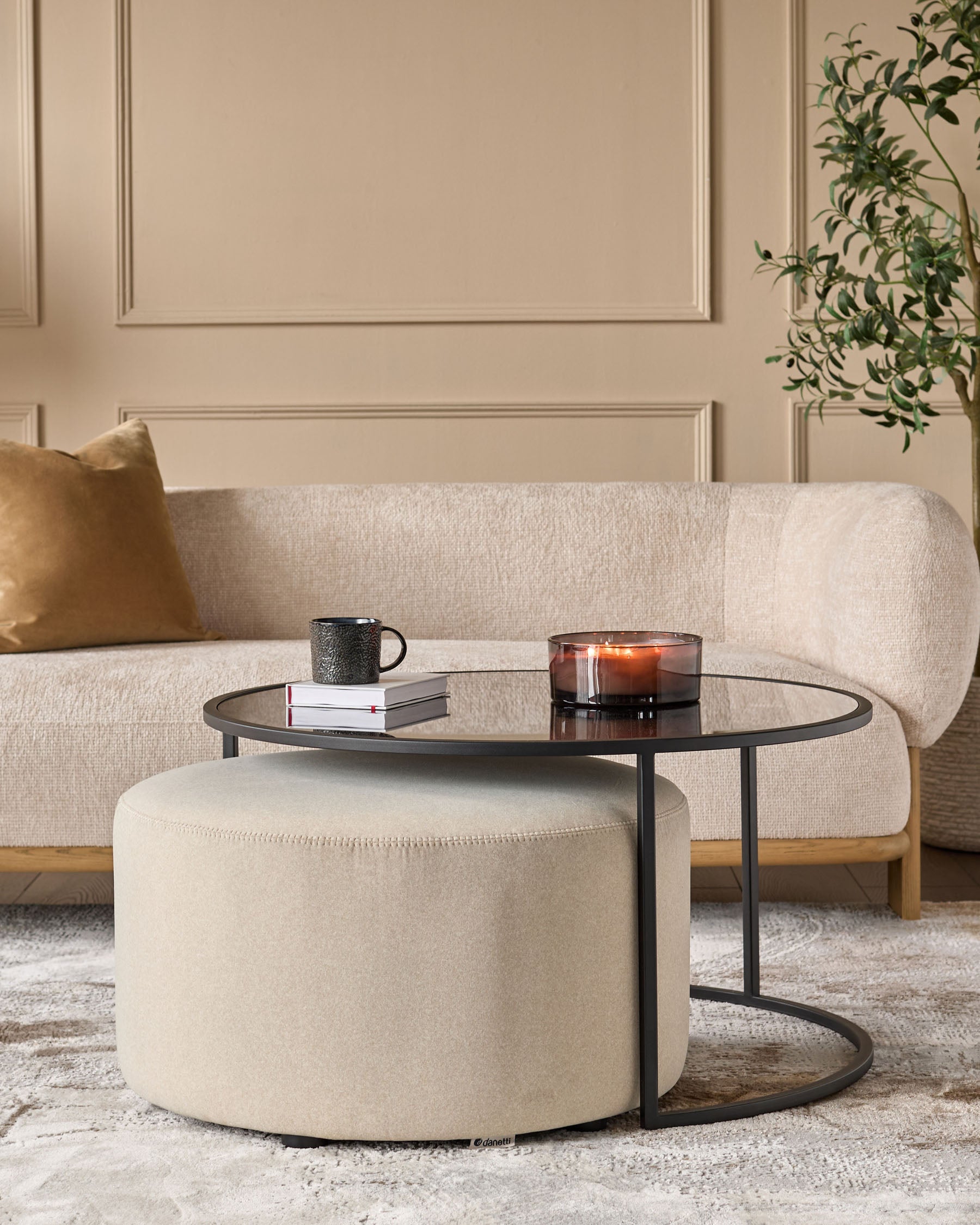 Thea smoked mirror coffee table and cream fabric pouffe set