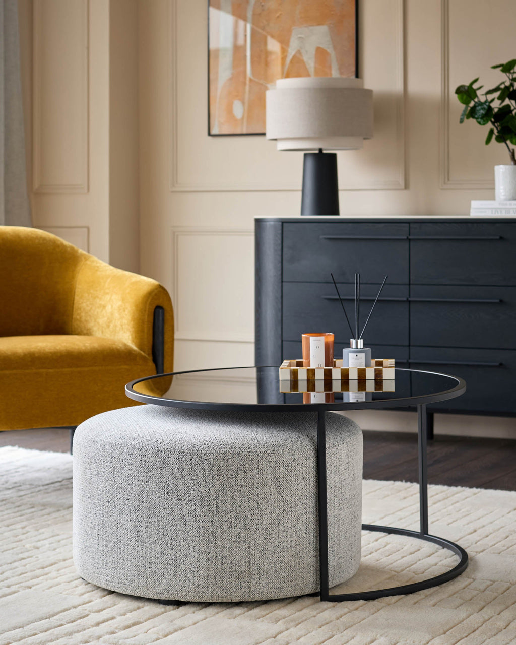 Thea smoked mirror coffee table and light grey fabric pouffe set